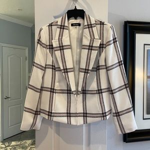 White blazer; black and pink stripes